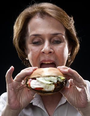 woman eating a hamburger