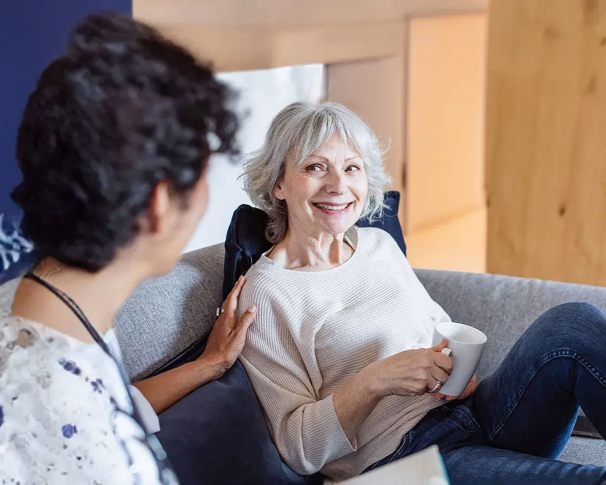 Older female patient talking to a doctor