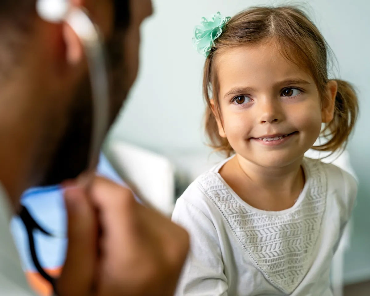 Doctor talking to young girl