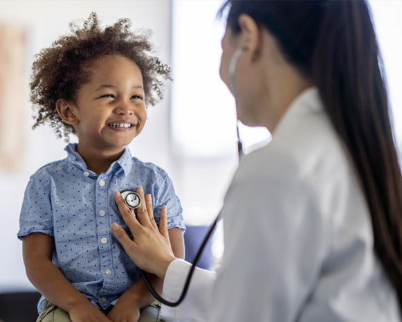 Doctor examining a child with a stethoscope