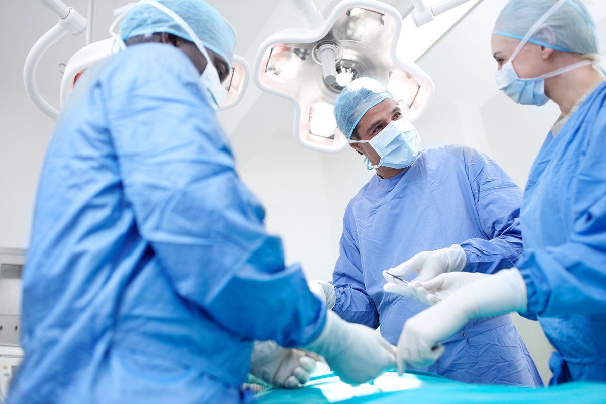 Medical staff assisting during surgery