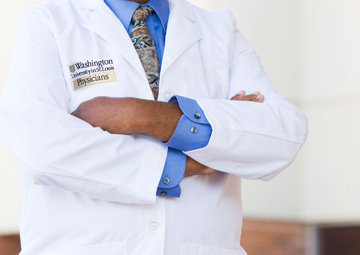 Doctor wearing a Washington University in St. Louis Physicians coat
