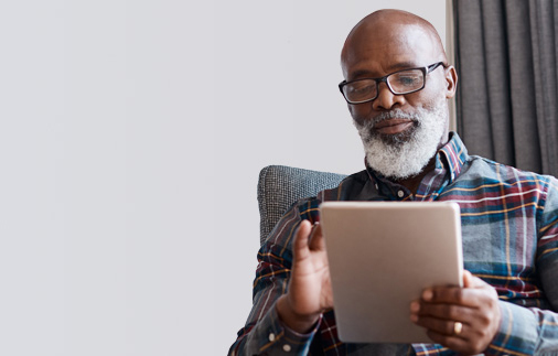 Man reading a tablet