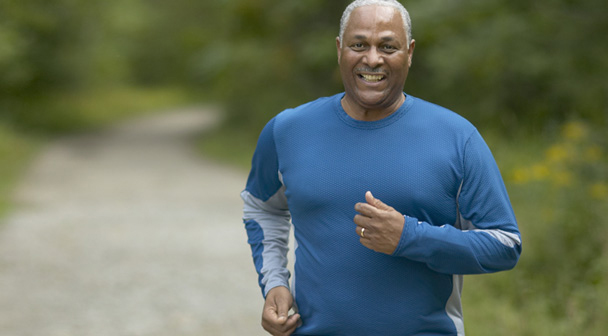 Man running and smiling outdoors