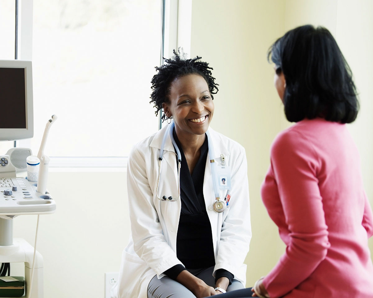 Doctor talking to a patient and smiling