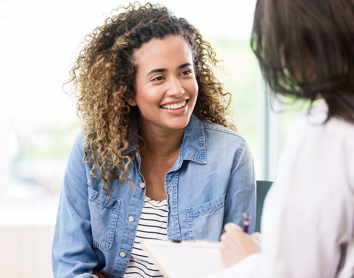 Woman smiling at doctor