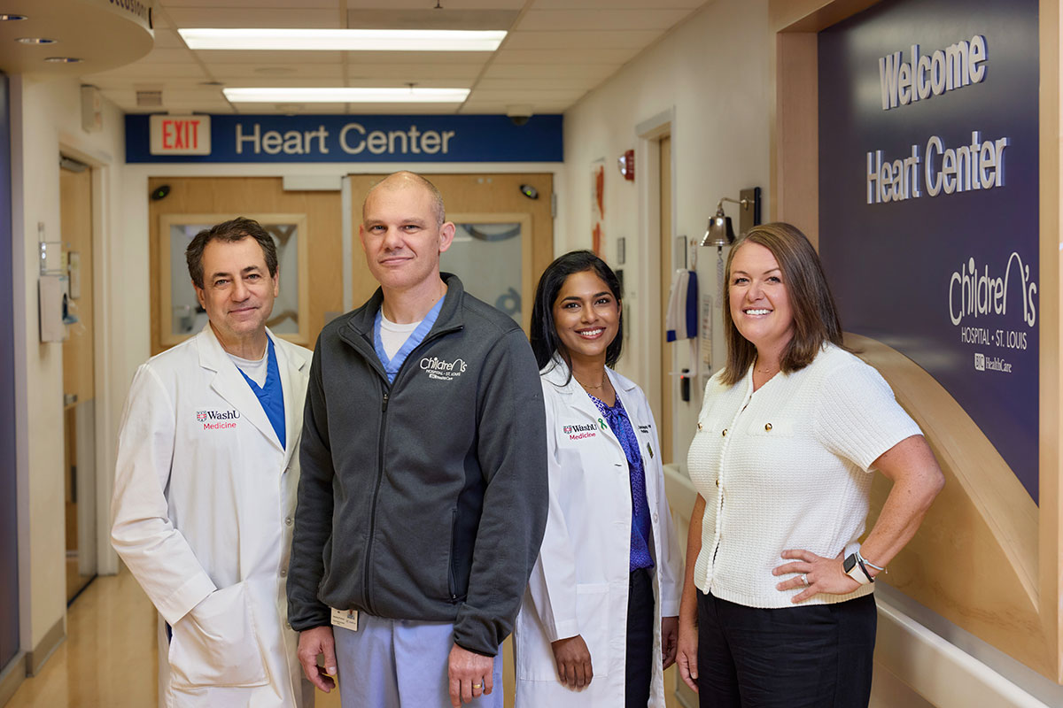 Heart surgeon Dr. Jacob Miller and team smiling