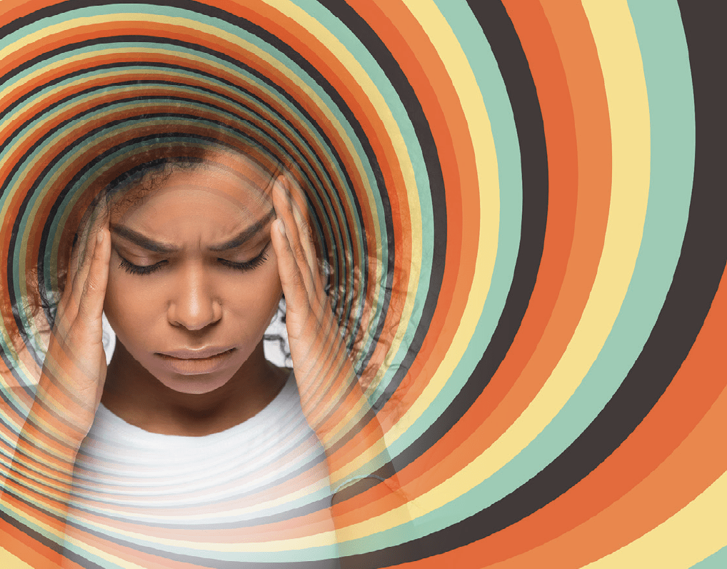 Woman with hands over temples, with a spiral vortex of orange, black, yellow, and green colors surrounding her