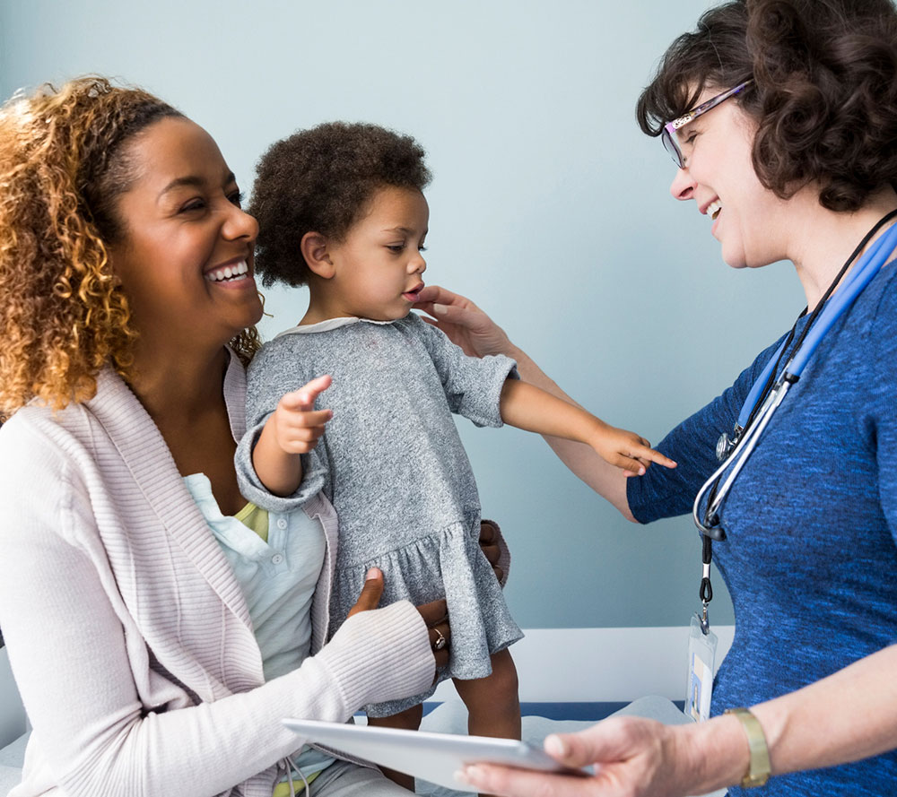 Mom with daughter and doctor at the doctor's office.