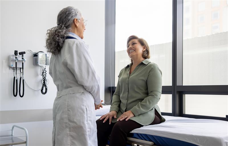 A doctor and a patient having a conversation 