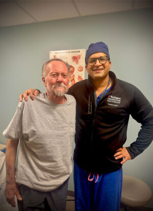 Darrell Bosworth (left) stands with Adeel Khan, MD. Khan, a professor of surgery at WashU Medicine, worked with Jessica Lindemann, MD, PhD, an assistant professor of surgery, to perform Bosworth’s robotic double liver and kidney transplant.