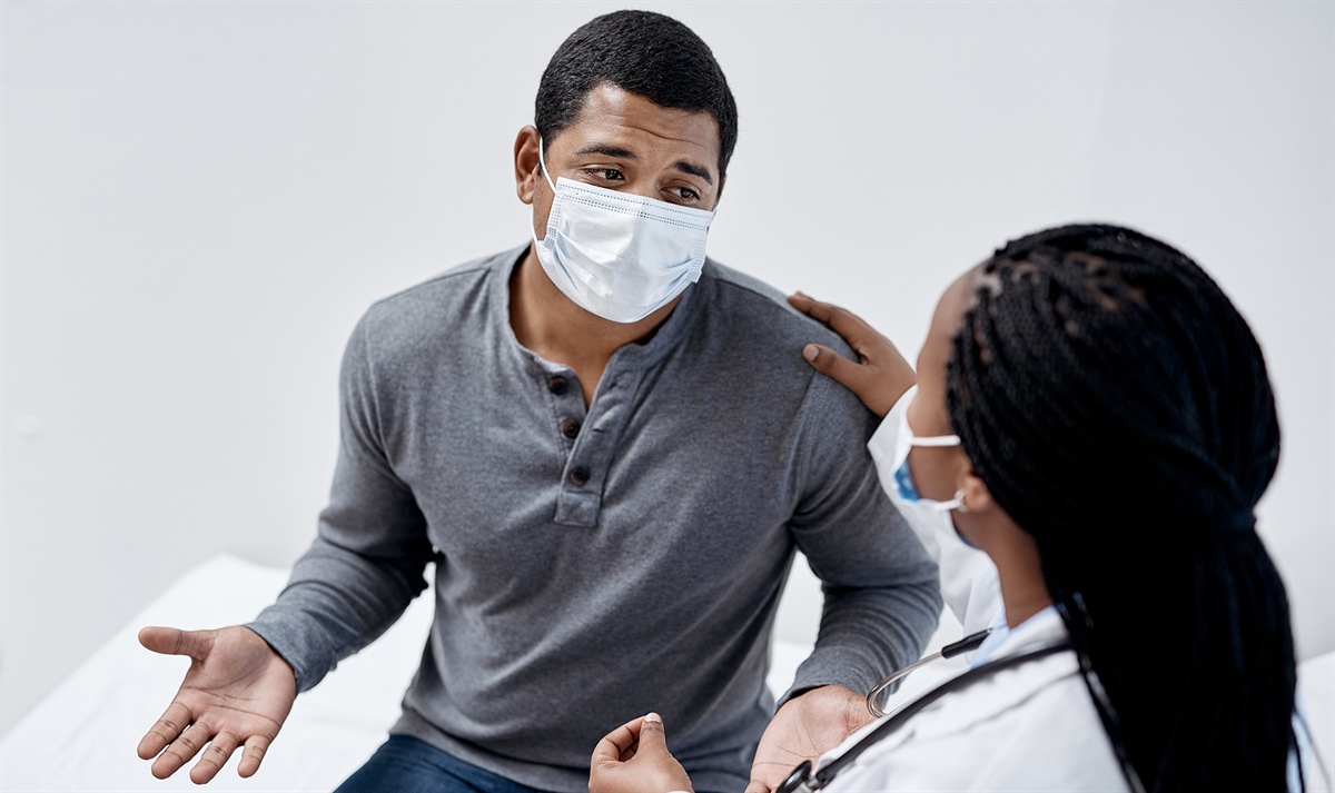 person speaking with a doctor