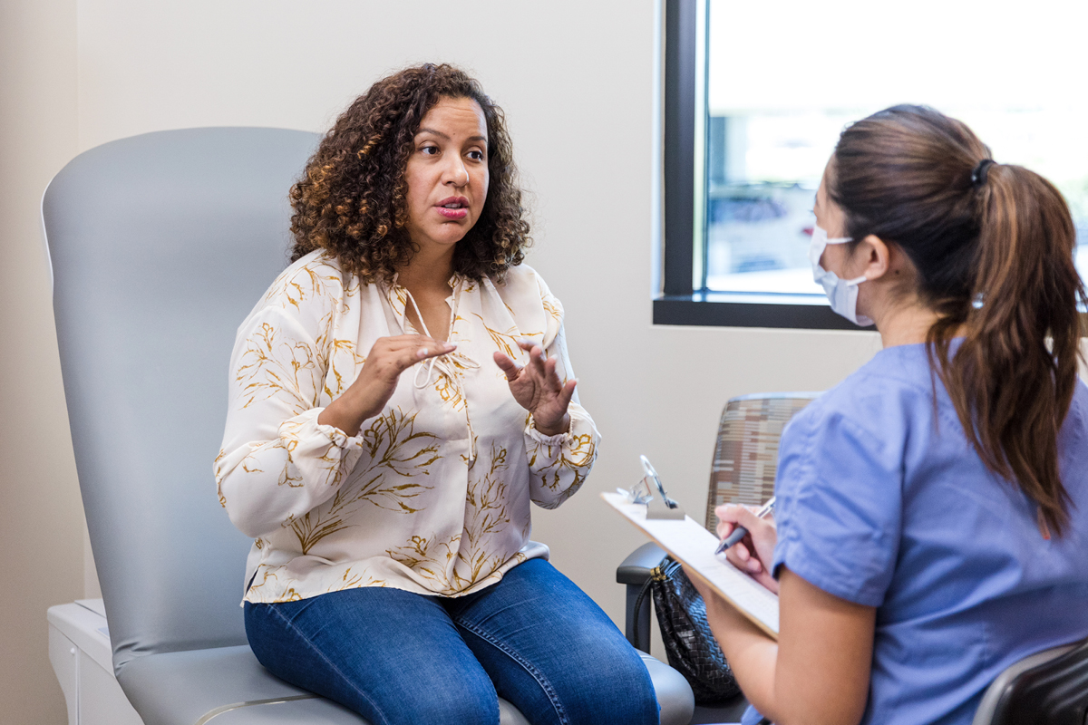 Patient talking to a doctor/nurse at the doctor's office