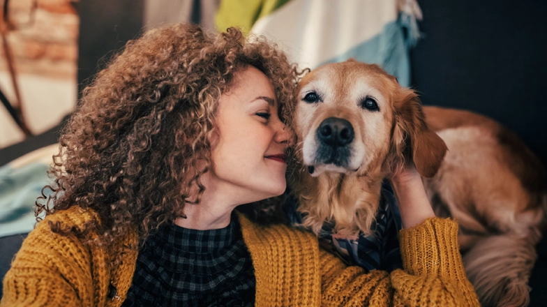 Woman smiling at a dog