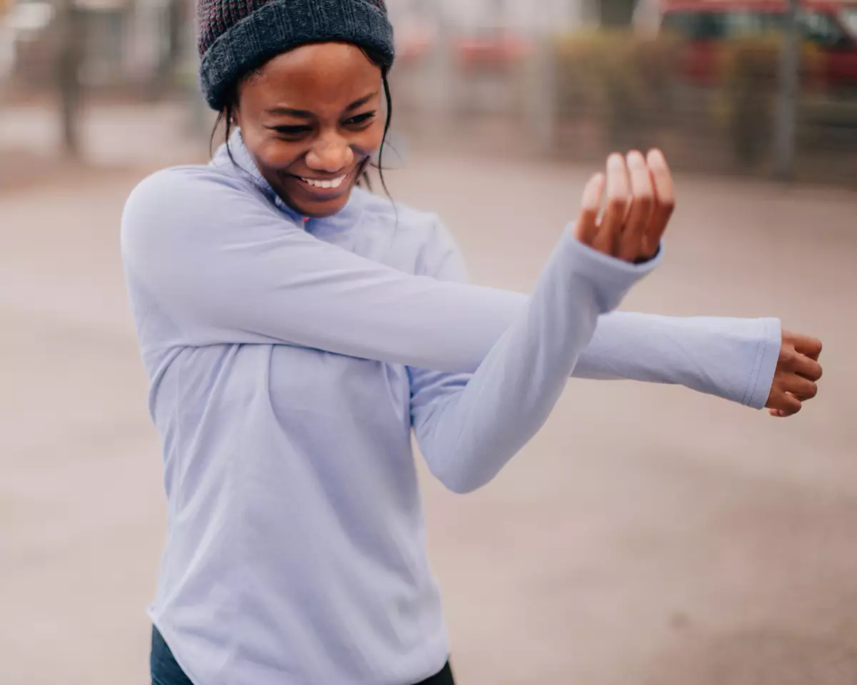 Woman stretching before winter exercising