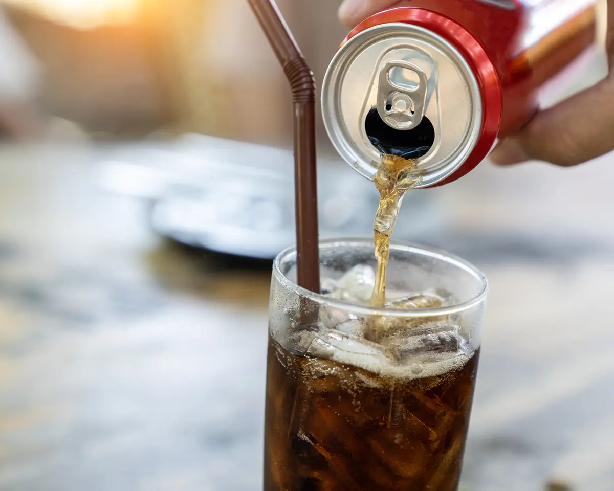 Soda being poured into a glass