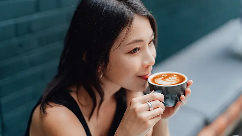 Woman drinking a cup of coffee