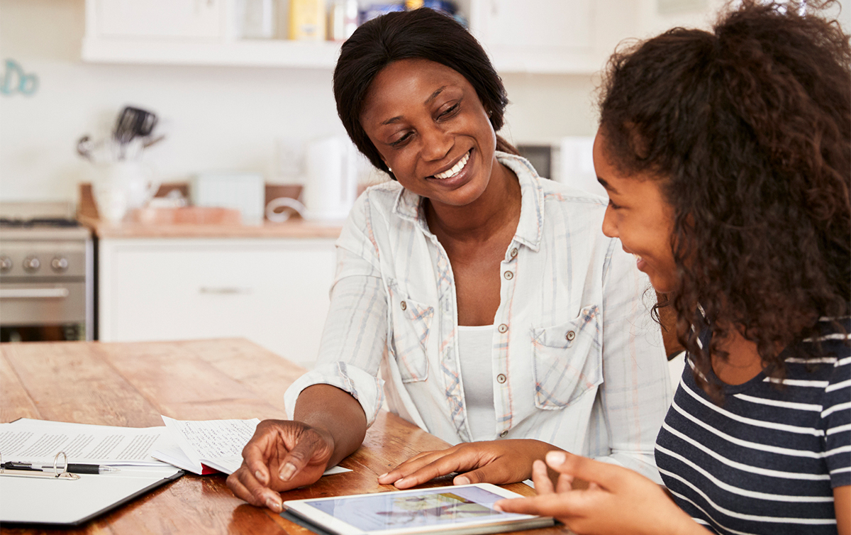 two people looking at a tablet