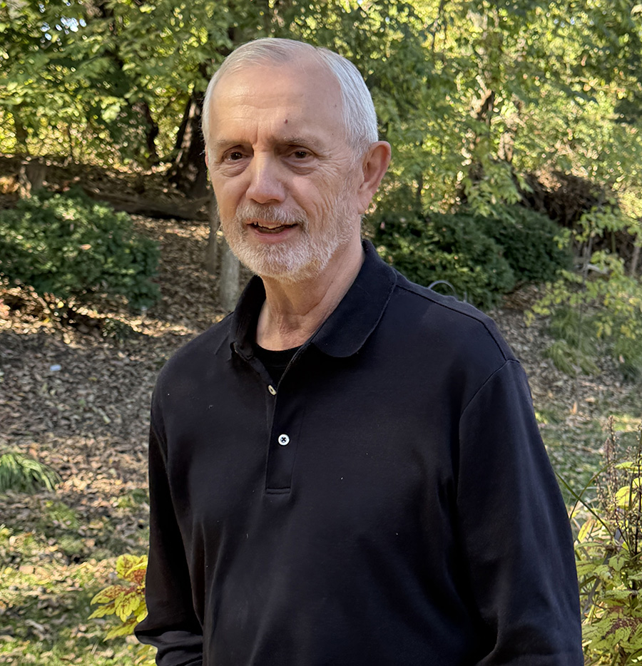 Portrait of a smiling patient John Cline after stroke recovery.