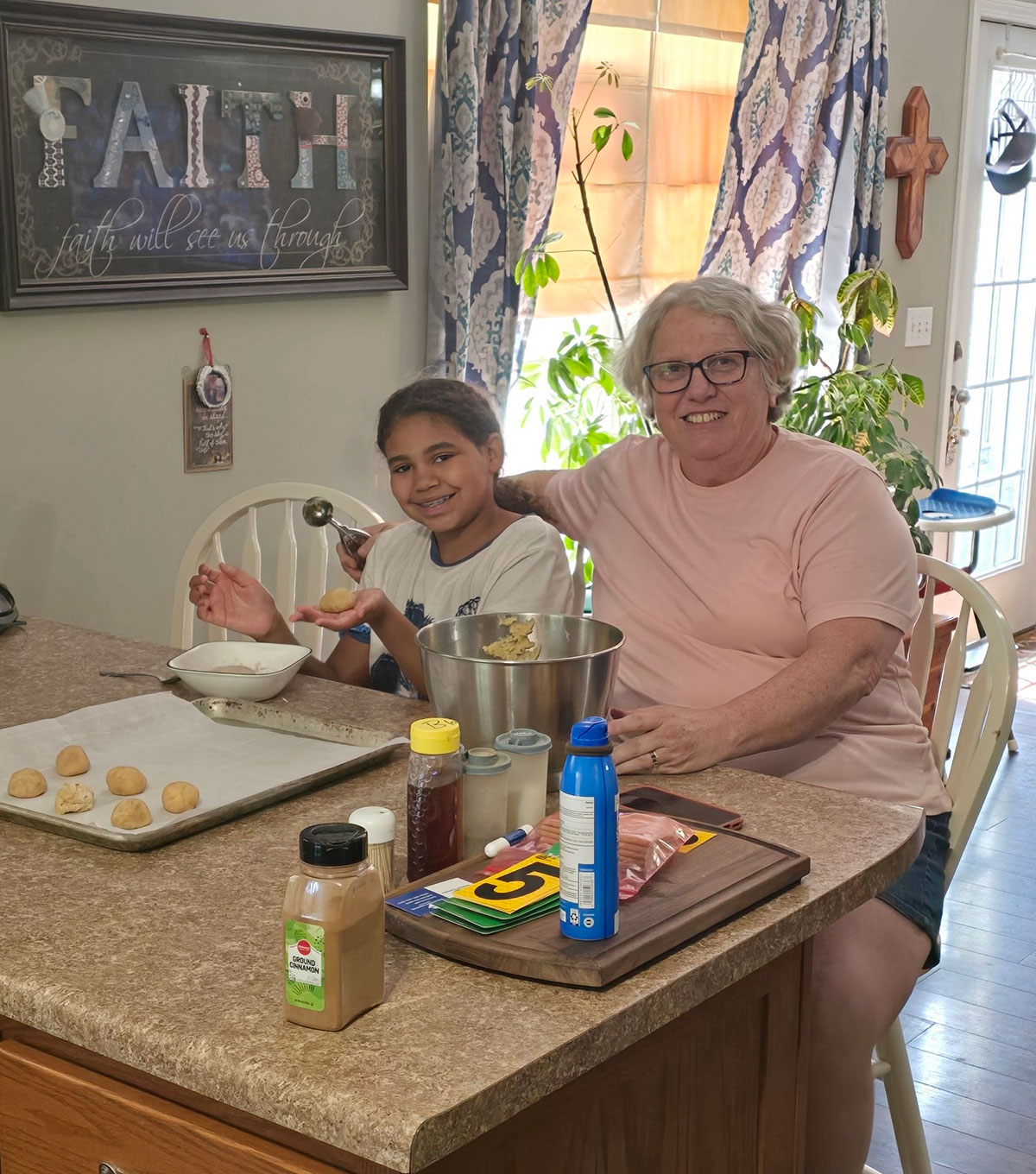 Patient Pam Ludy sitting with her grandchild