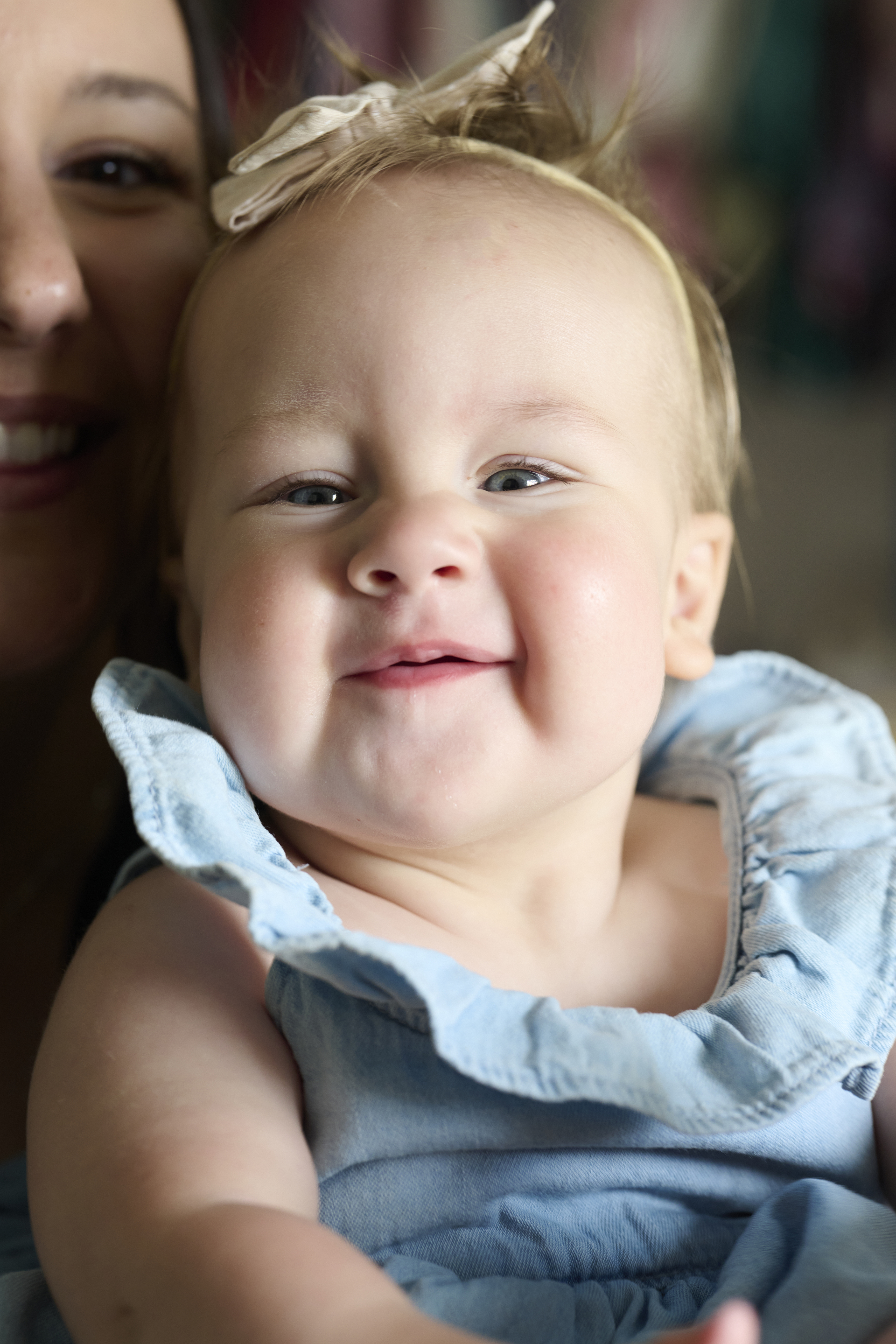 Jill Rongey's daughter, with half face of Jill to left side