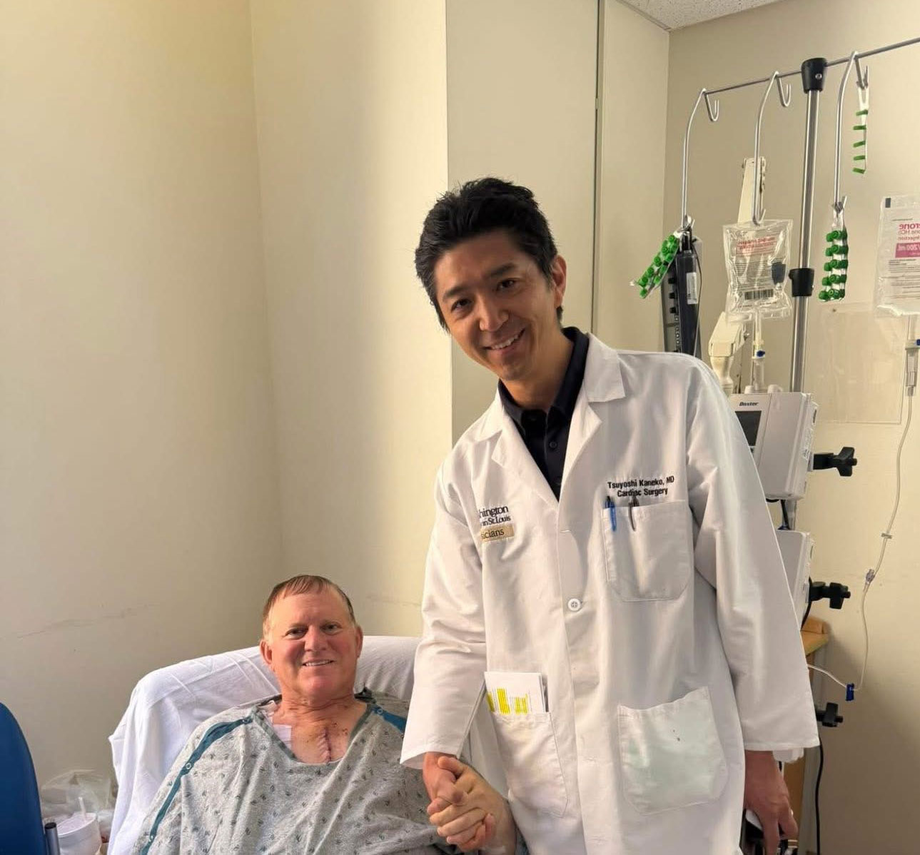 Patient Vic and Dr. Kaneko smiling in a patient room after surgery