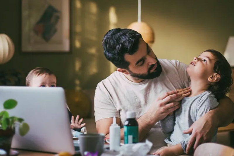 Father sitting with child on his lap