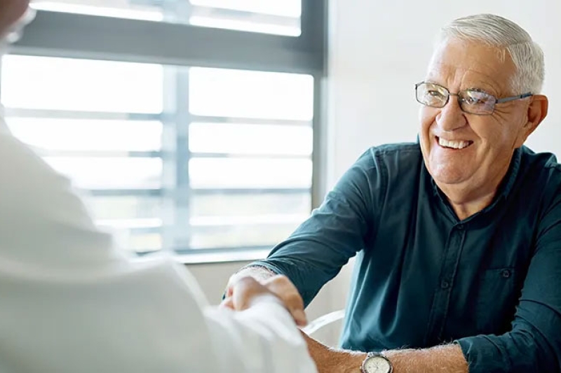 Man shaking hands with a doctor