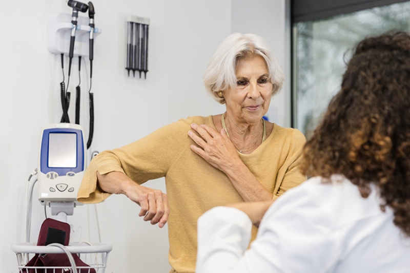 Shoulder patient with their physician