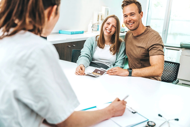 A young couple talking with a counselor